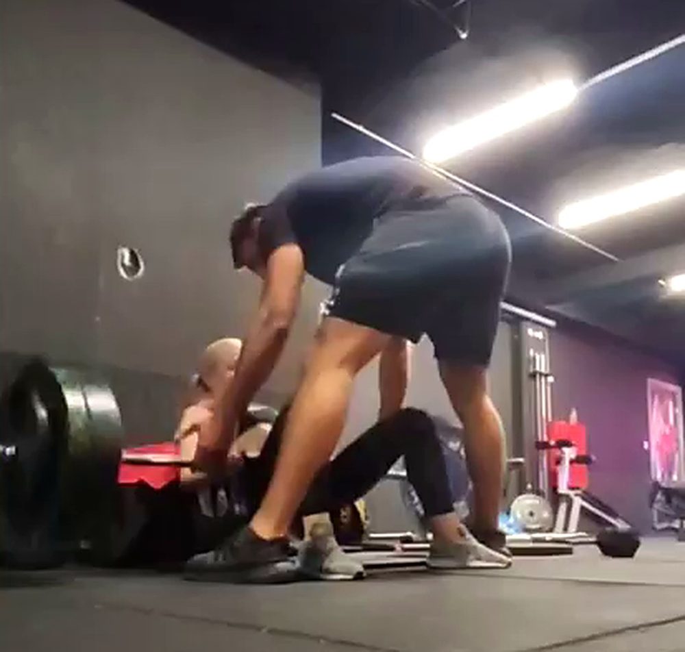 Billy spotting a client’s barbell hip thrust